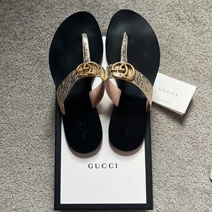 Gucci- Women’s GG Marmont Thong Sandals- Metallic gold straps